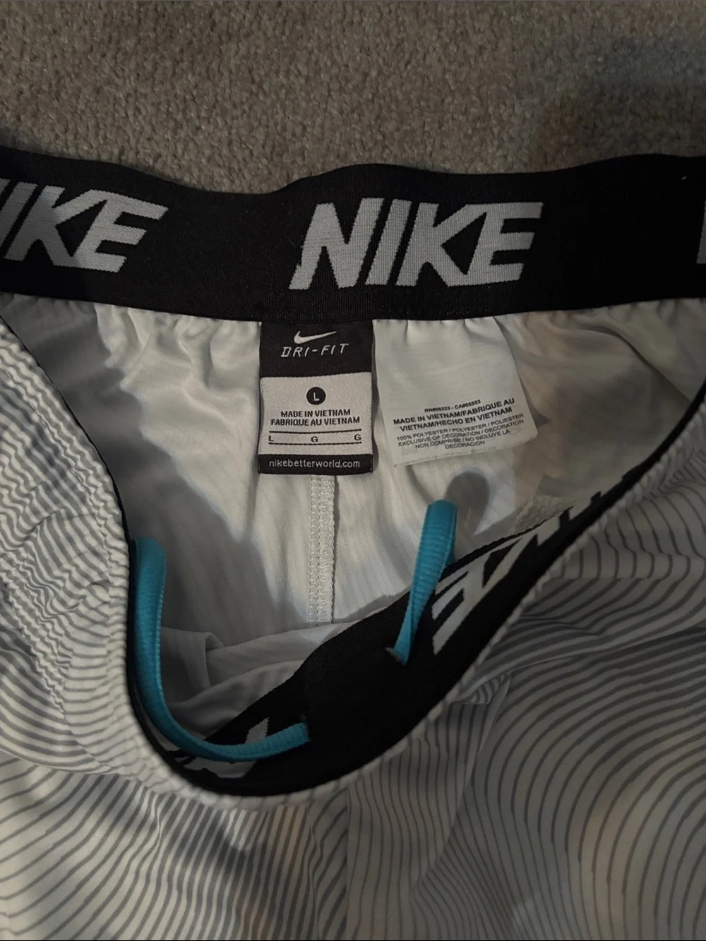Nike Men’s White Athletic Shorts with Blue Swoosh - Picture 2 of 6